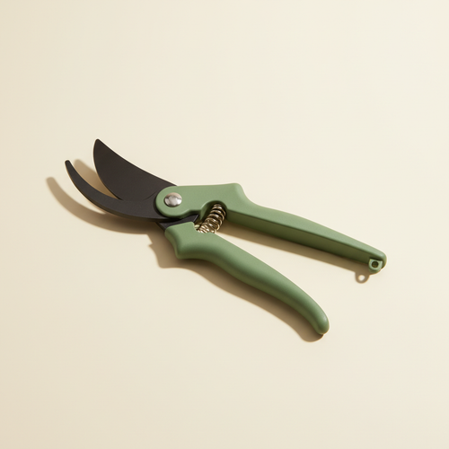 Bypass pruning shears on a warm off-white studio background